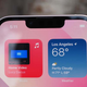 A photo of a person holding an iPhone 13